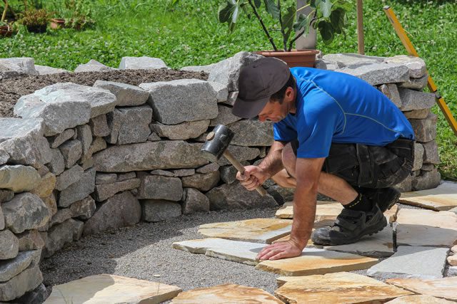Who defines acceptable quality from a landscape company?