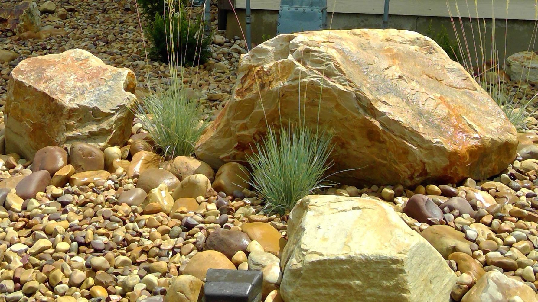 What should I do before winter for landscaping installed by a company?
